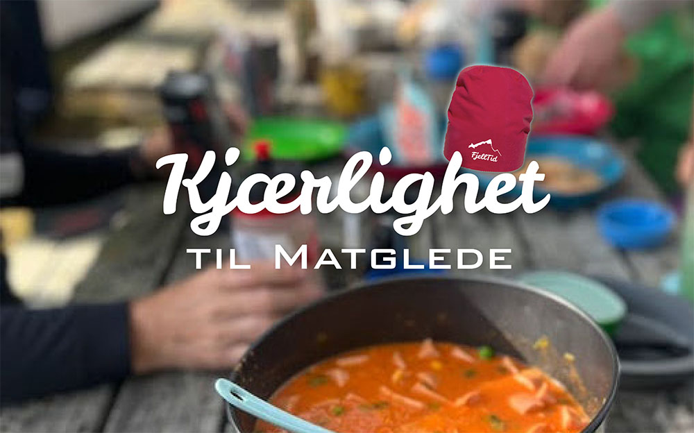 Kjærlighet til matglede. Gryte med gryterett på et trebord omgitt av mennesker.